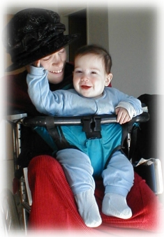 Malka and Avraham demonstrate their wheelchair infant-toddler carrier.  